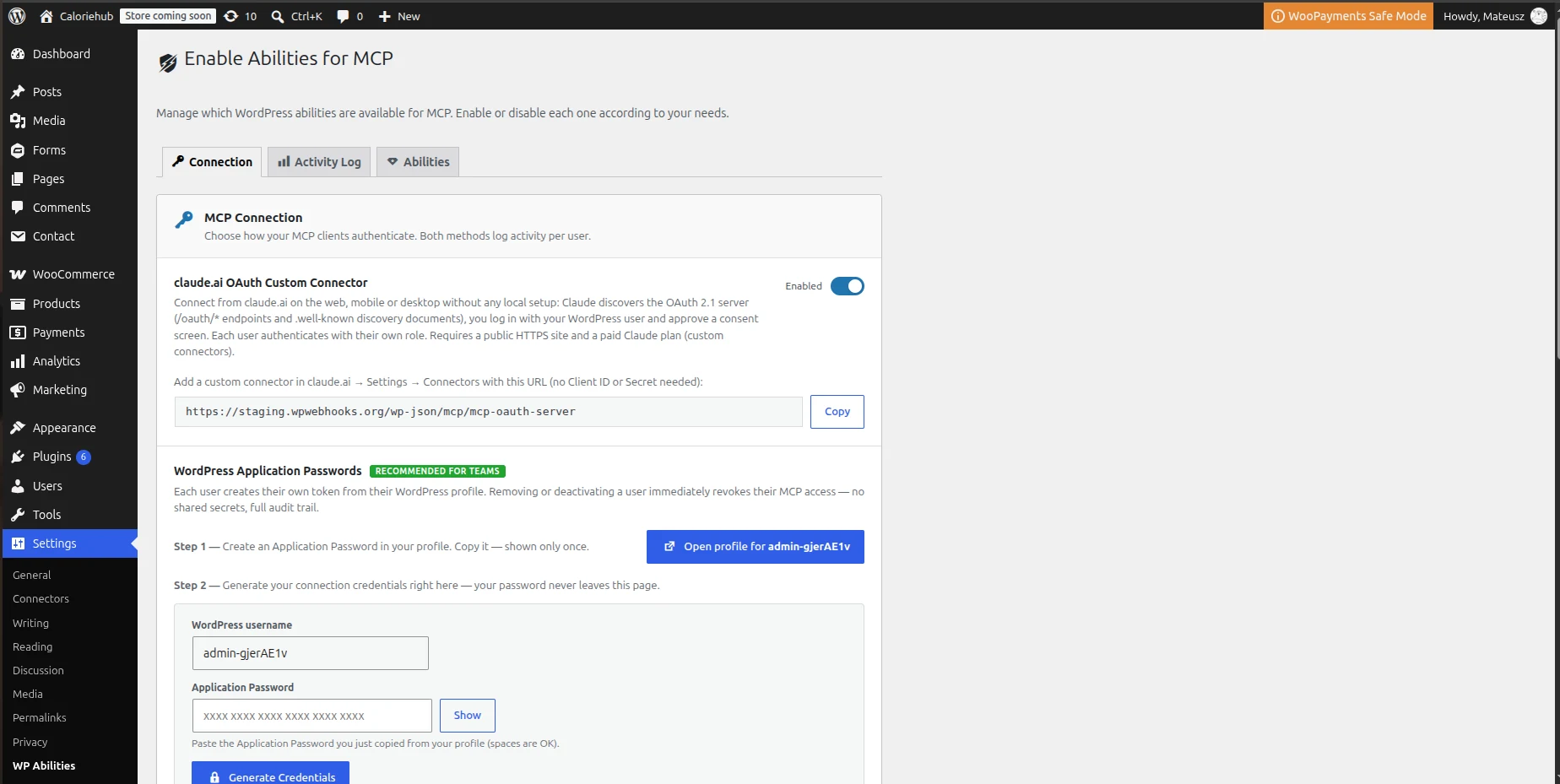 The Enable Abilities for MCP settings screen in WordPress, on the Connection tab. A section headed “claude.ai OAuth Custom Connector” is toggled Enabled, above the connector URL https://staging.wpwebhooks.org/wp-json/mcp/mcp-oauth-server with a Copy button. Below it a WordPress Application Passwords section, marked “Recommended for teams”, offers to generate connection credentials.