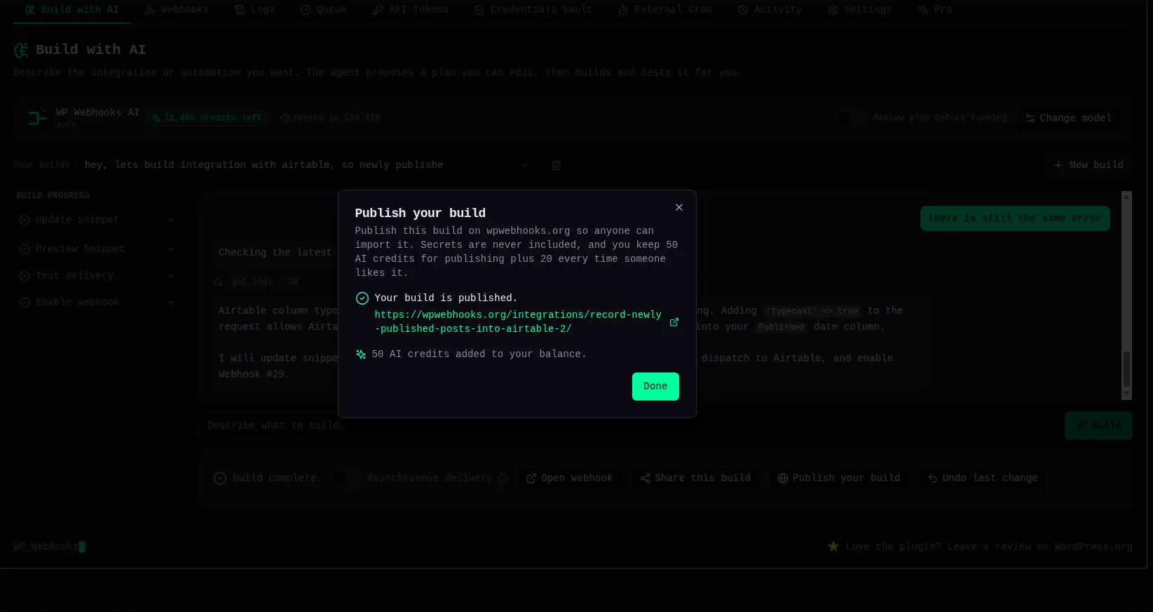 The Publish your build dialog after publishing, confirming “Your build is published.” with a link to the new page on wpwebhooks.org and “50 AI credits added to your balance.”